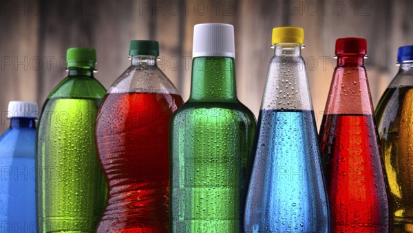 Plastic bottles of assorted carbonated soft drinks in variety of colors
