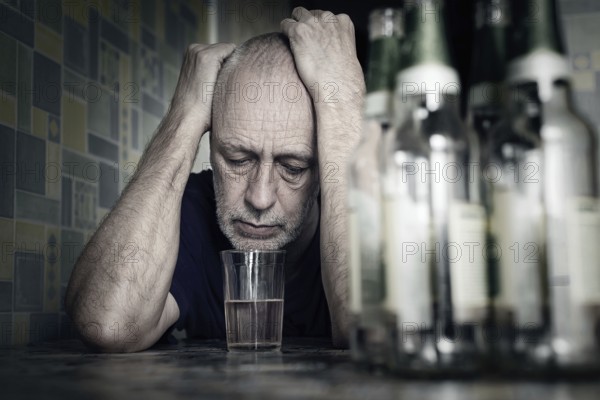 A desperate man falls into depression and becomes alcoholic and miserable. His addiction leads him to a state of loneliness and poverty. He has no hope and could be suicidal