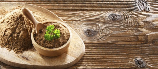 Composition with a bowl of ground coriander