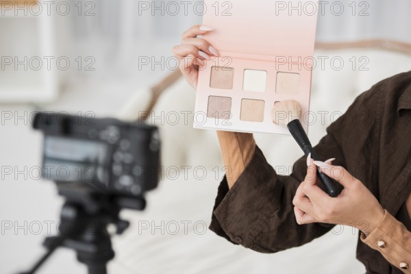 Close up woman holding make up colors