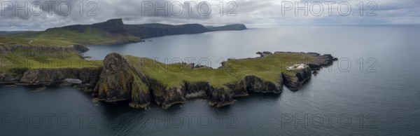 A panorama drone view of the Neist Point Lighthouse and the Minch on the western coast of Isle of Skye