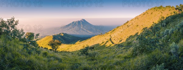 Panoramic photo of mountains surrounding Mount Merbabu near Yogya in central Java province in Indonesia. In this region, one can only meet people from isolated local tribes
