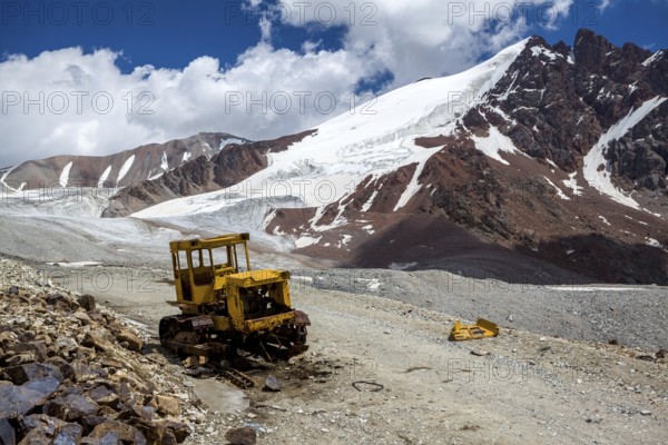 Abandoned broken bulldozer. Kok-Airyk pass, Tien Shan mountains, Kyrgyzstan