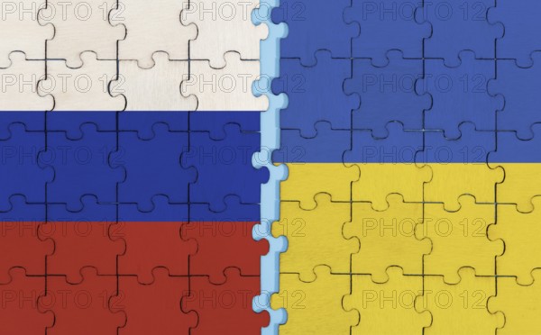 Russia and Ukraine flag on puzzle background