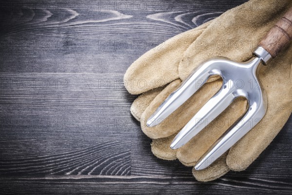 Stainless steel trowel fork leather protective gloves gardening concept