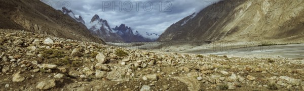 Panorama of beautiful Karakoram Mountain Range with majestic peaks of Trango Towers above Baltoro Glacier