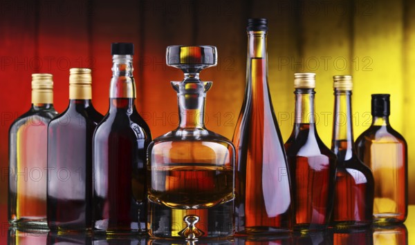 Composition with bottles of assorted alcoholic beverages