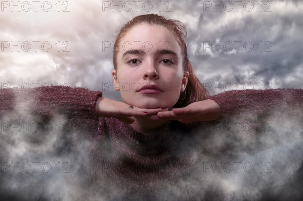 Composition, young woman in the clouds