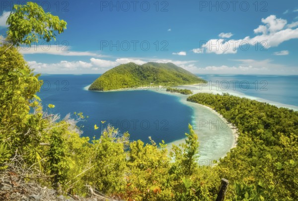 Photo of clear blue sea and greenery of Kri island, Raja Ampat, West Papua, Indonesia. In this region, one can only meet people from isolated local tribes