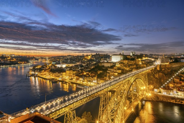 Porto with the Dom Luis I bridge and the Douro river after sunset