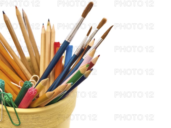 Different office supplies over the white background