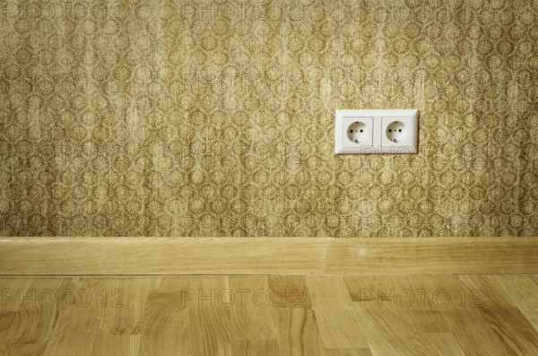 Double Socket In The Wall Of An Empty Room