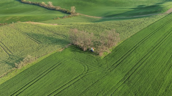 Aerial view of Chapel st. Barbara on South Moravian hill fields during spring time, Moravia, Czech Republic