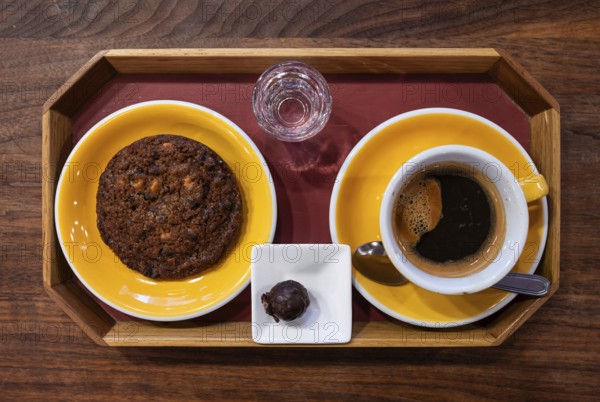 Plate with American style chocolate cookie, a coffee and a luxury chocolate, Brussels, Belgium