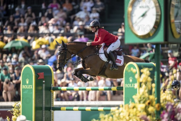 Jorne Sprehe of Germany and riding Sprehe Hot Easy compete in the first round of the 1.60m CPKC International during the Spruce Meadows Masters, presented by Rolex, in Calgary, Alberta, Canada, North America