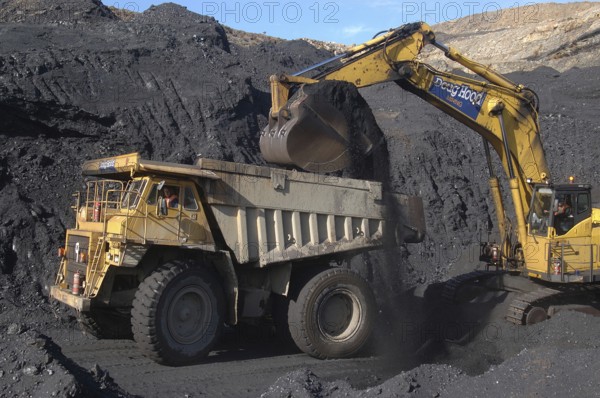 WESTPORT, NEW ZEALAND, CIRCA 2007: Digger loads up a truck with high grade coal at Stockton Coal Mine, West Coast, South Island, New Zealand