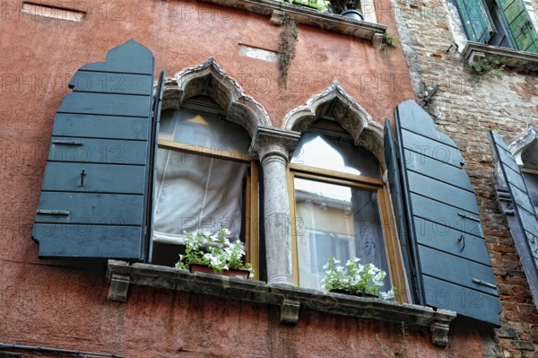 Part of the wall with window. Medieval house in Venice