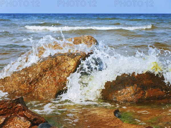 Waves Breaking On Rocks At The Sea Shore