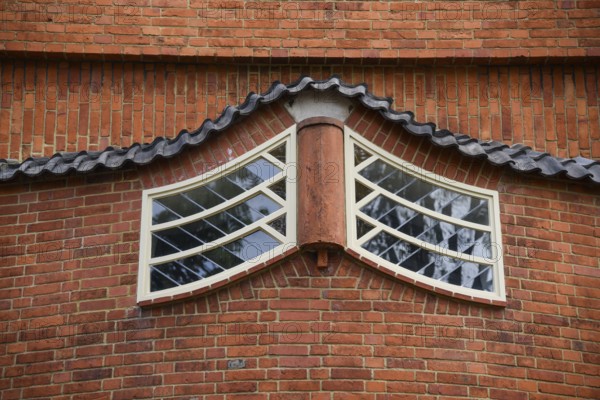 Amsterdam, Netherlands. June 2022. View of the facades of the characteristic brick building of residential complex with Amsterdam School style architecture