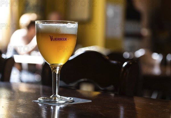 Kessel-Lo, Flemish Brabant Region, Belgium, 08 21 2022, Close up of an amber abbey beer called Vlierbeek at a local pub