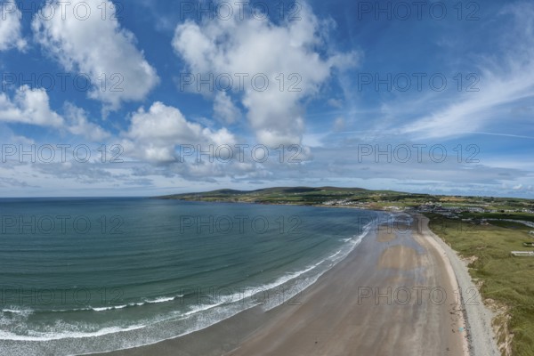 An aerial panorama view of the Bray Head cliffs and headland on Valentia Island at sunset aerial view of the endless golden sand beach in Ballybunion on the west coast of Ireland