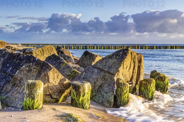 Wooden and rocky groynes on the coastline of the Baltic Sea, Germany