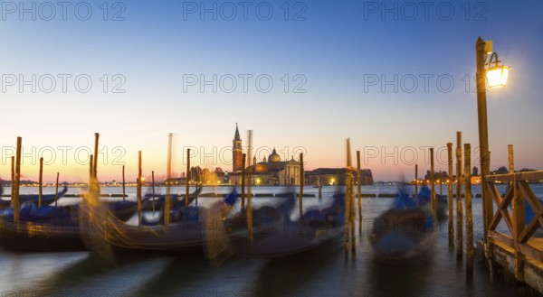 Gondolas at sunrise with San Giorgio di Maggiore church, Venice, Venezia, Italy
