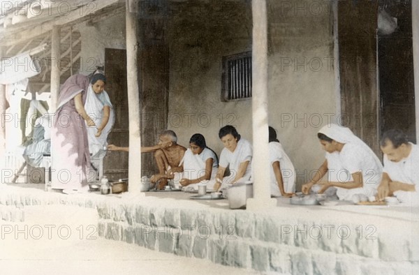 Mahatma Gandhi and others taking dinner Sevagram Ashram, Wardha, India, Asia, November 1933