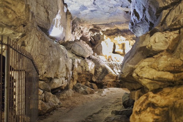 A stalactite cave with a path in the middle