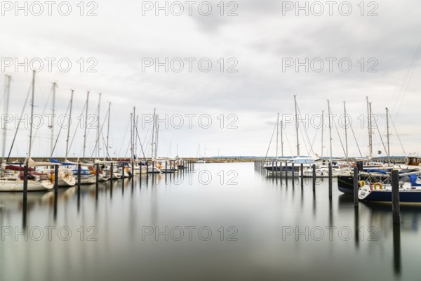 Sassnitz, Germany, August 1, 2019: Scenic long exposure view of sailing boats moored in the harbour. Sassnitz is a small town located in Rugen Island