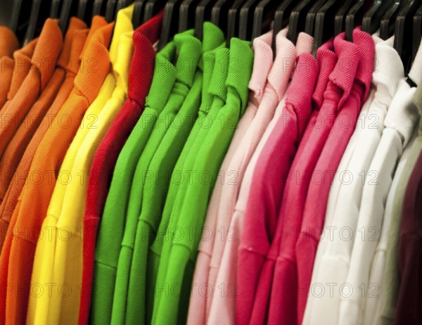 Colorful t-shirts hanging on a rack