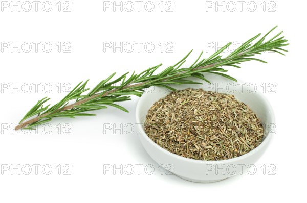Sprig fresh rosemary and a bowl with dried rosemary