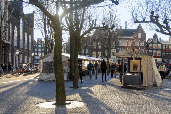 Tourists visiting the fair at Spui Square