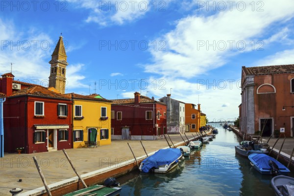Inclined tower - a landmark of the island of Burano. Burano is island of multi colored bright houses near Venice. Province of Veneto. The concept of cultural, historical and photo tourism