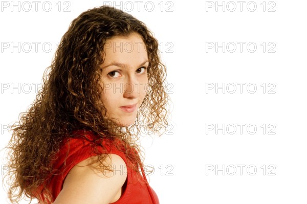 Portrait of a shy girl in red