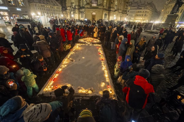On 13 and 14 February 1945, Dresden was heavily destroyed in three Allied bombing raids. Every year, the people of Dresden commemorate this event at various events. A long human chain symbolises the protection of the city centre. Candles are placed in front of the Church of Our Lady, Dresden, Saxony, Germany