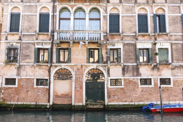 Facade of a palazzo on a canal, Venice, Italy
