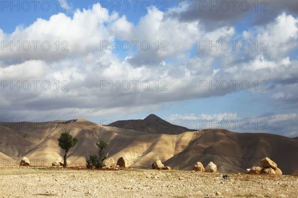Magnificent transparent day in Judean desert. Easy shades from clouds on soft hills