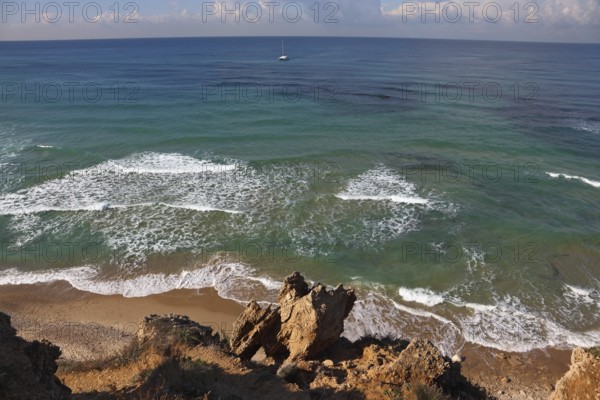 Warm winter in Israel. Coast of Mediterranean sea in serene silent midday