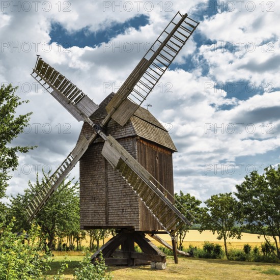 A view of a beautiful windmill in Germany in a natural setting and an eye catcher for tourists