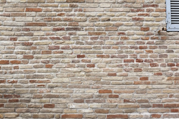 An image of a typical red brick wall background texture