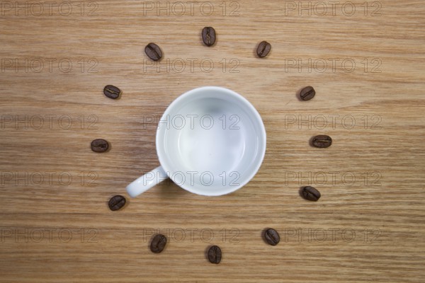 Coffee Time - Empty coffee cup and clock of coffee beans