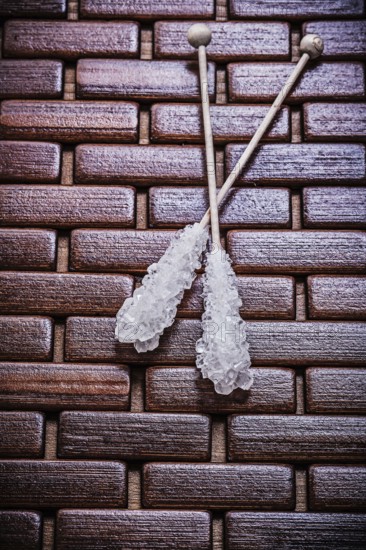 Tasty sugar sticks on wooden matting food and drink concept
