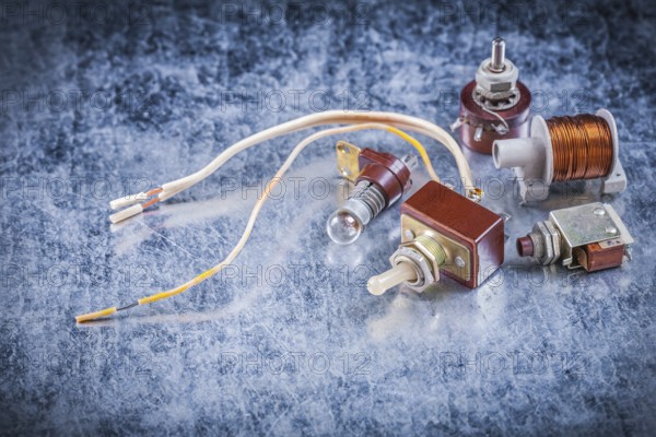Group of electric devices on metallic background vintage electricity concept