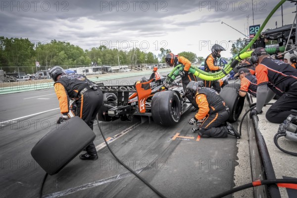 SANTINO FERRUCCI (14) of Woodbury, Connecticut comes down pit road for service during the XPEL Grand Prix at Road America in Elkhart Lake, WI