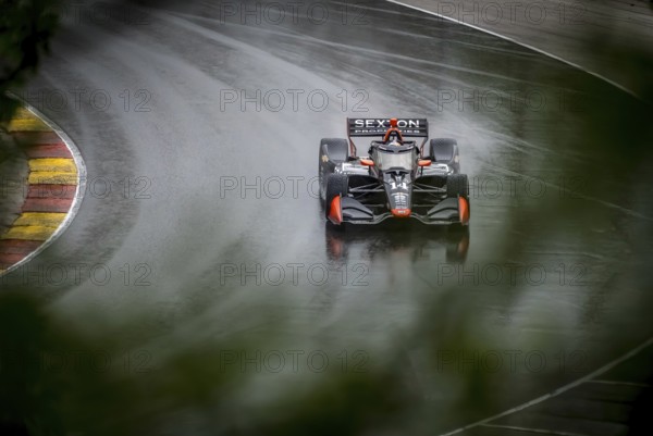SANTINO FERRUCCI (14) of Woodbury, Connecticut comes through turn 12 (Canada Corner) during a wet practice session for the XPEL Grand Prix at Road America in Elkhart Lake, WI
