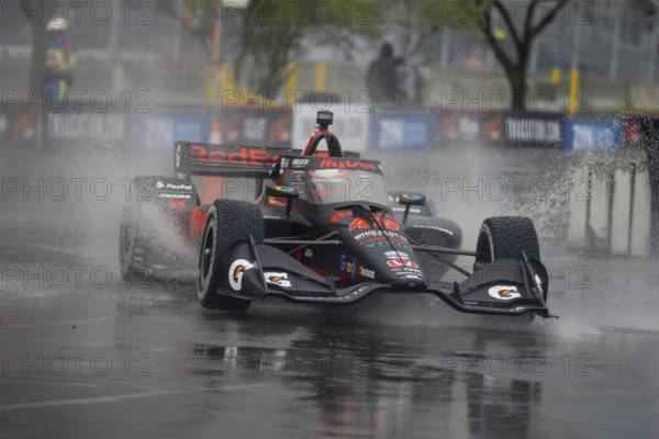 INDYCAR Series driver, CHRISTIAN LUNGAARD (45) of Hedensted, Denmark, travels through the turns during a wet and dangerous practice session for the Big Machine Music City Grand Prix at Streets of Nashville in Nashville TN