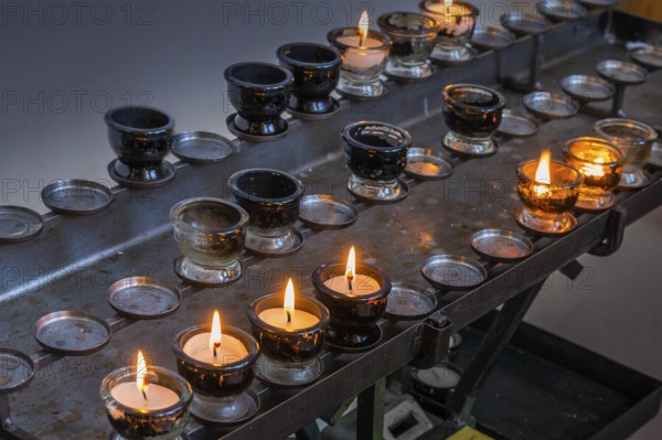 Sacrificial lights in the Catholic parish church of St Blasius in Dietmannsried, Allgäu, Bavaria, Germany