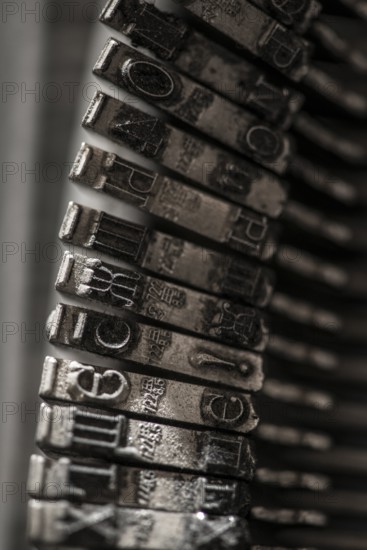 Metal letters on typewriter. Close up macro