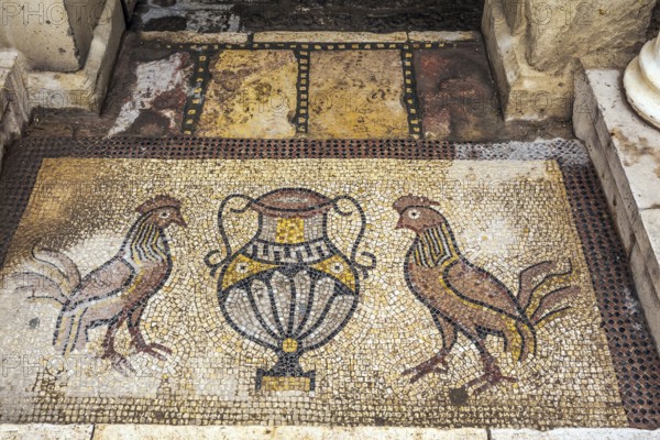 Monastery of Gerasim of Jordan. Picturesque mosaics adorn the entrance to the inner monastery courtyard. Israel. The concept of pilgrimage, religious and photo tourism